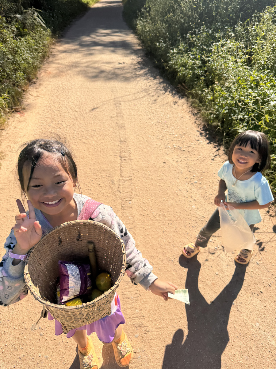 Three hill tribe children smiling UTMB