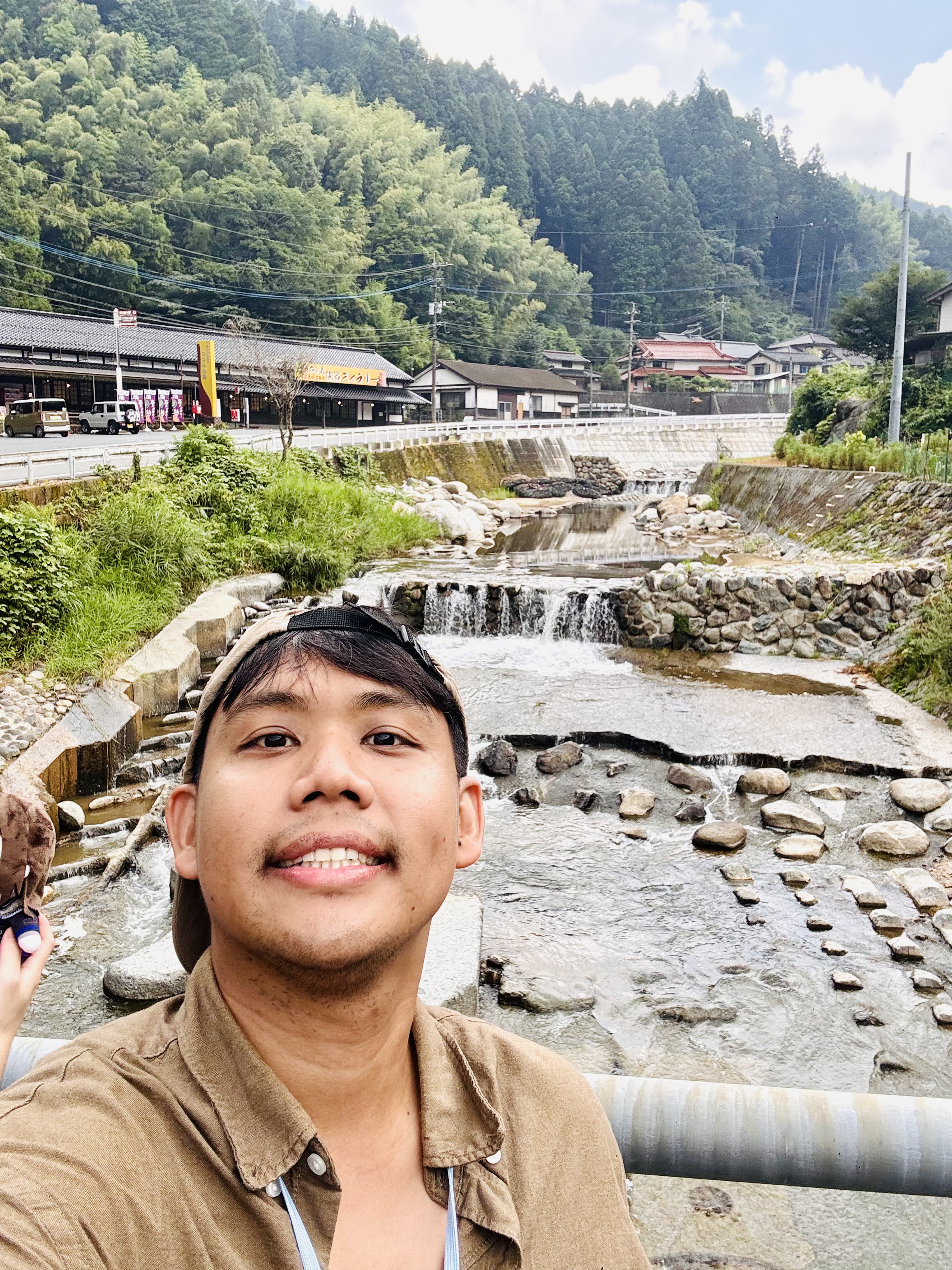 Selfie beside waterfall stream